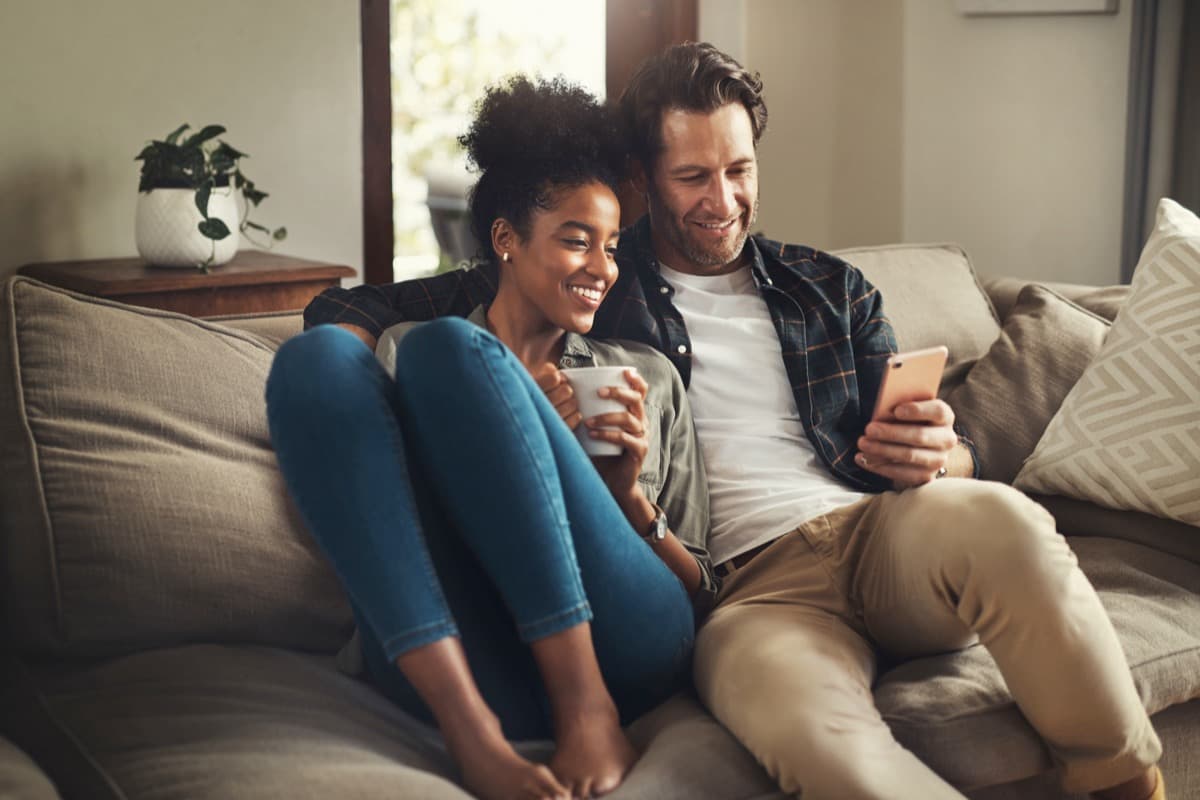 Happy couple using the app together
